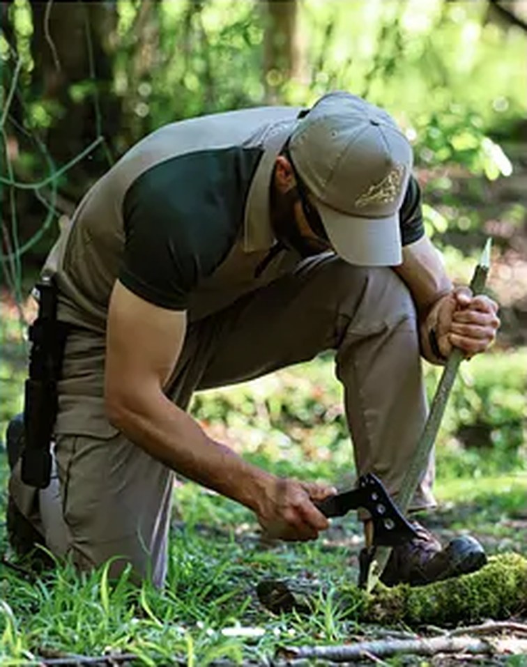 Hunter setting up camp in the forest